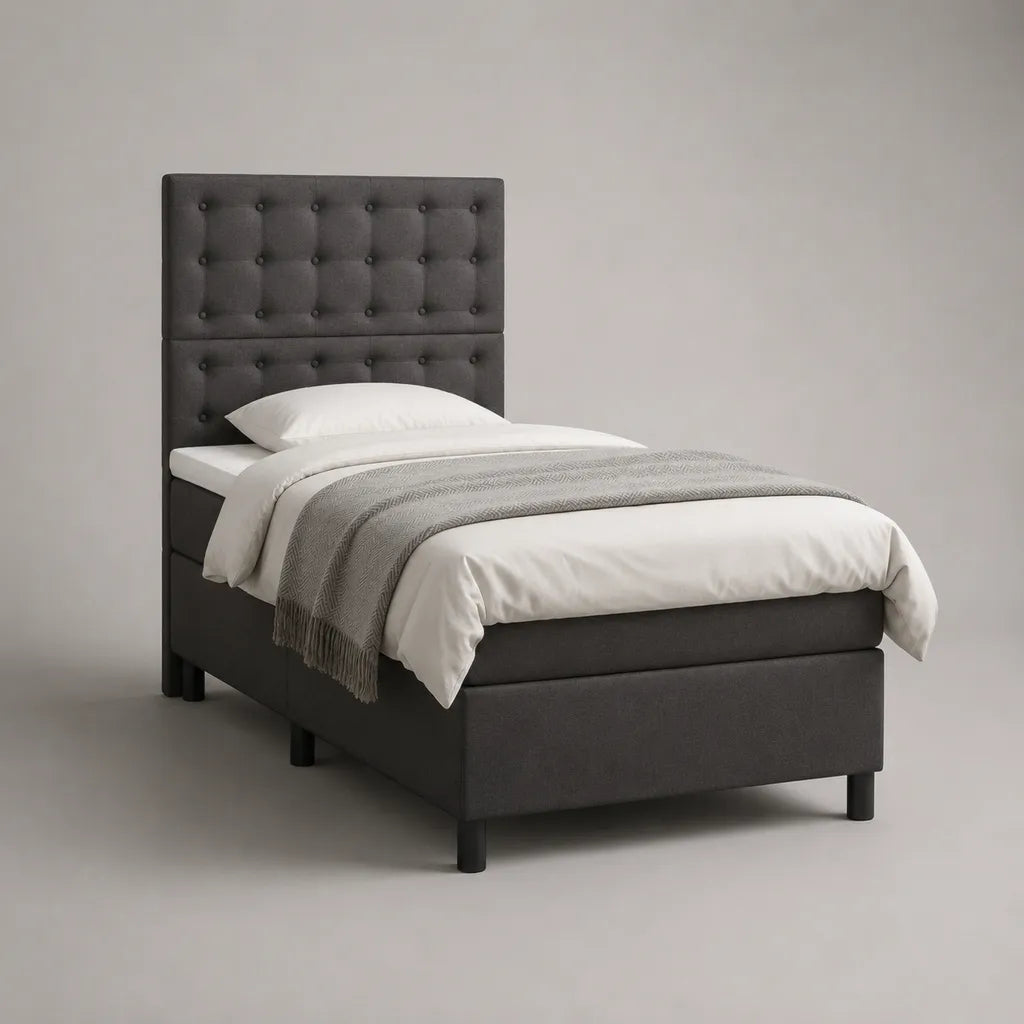Lit simple 90 × 190 cm en tissu gris foncé avec tête de lit capitonnée et sommier à lattes
